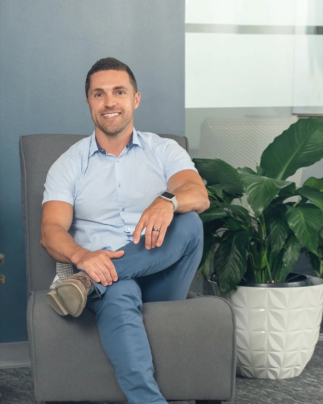 Alex Shafirovich, seated and smiling in a professional office setting